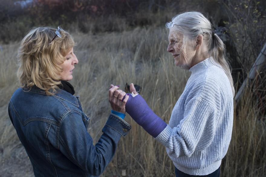 On Oct. 20, the day following Bob’s death, daughter Cat Kelley holds Jane’s healing arm as the two go for a walk on the Fallers’ Republic, Wash., property. 