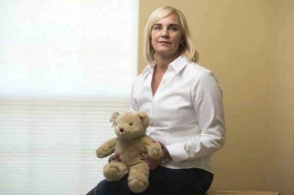 Cathleen Warner holds the teddy bear that has the recorded heartbeat of her daughter, Erin, who lived just 27 minutes.