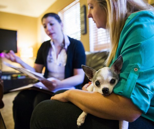 Amber Weiss talks with veterinarian Joanna Harchut about hospice care for her Chihuahua Boston.