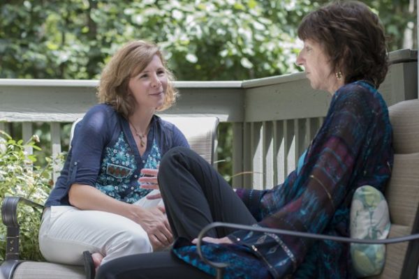 Death doula Shelby Kirillin chats with client Kim McGaughey.