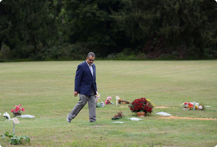 Elsayed "Steve" Elmarzouky walks through the area dedicated to Muslims in Laureldale Cemetery.